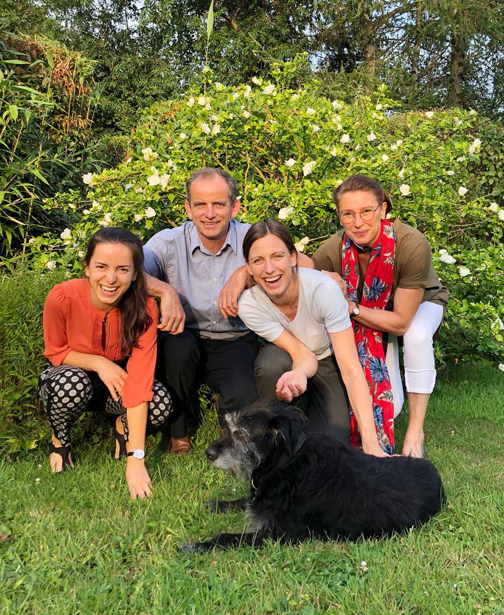 With his wife and two daughters